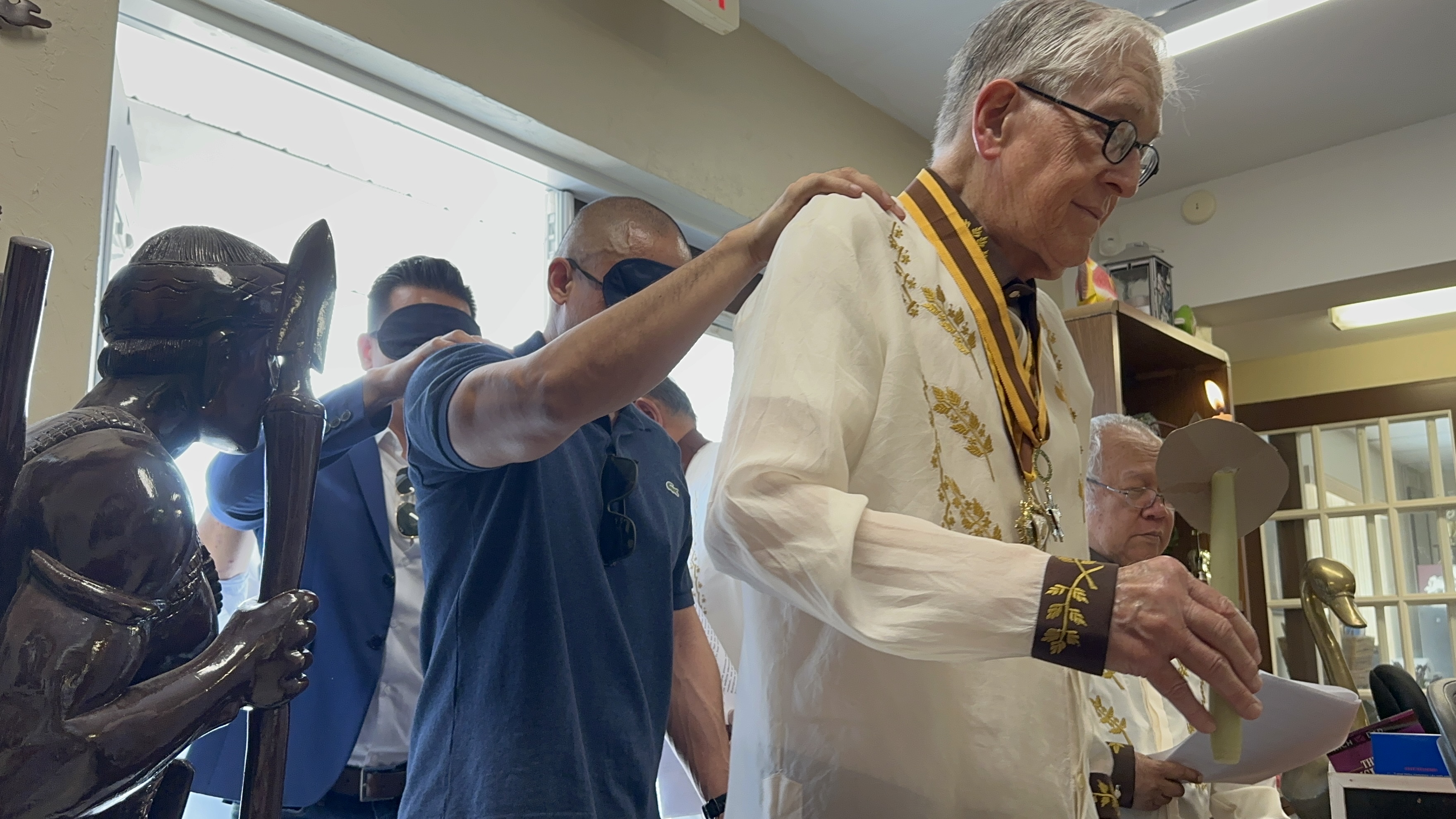 Senior Knight in Barong Tagalog with gold sash and medal