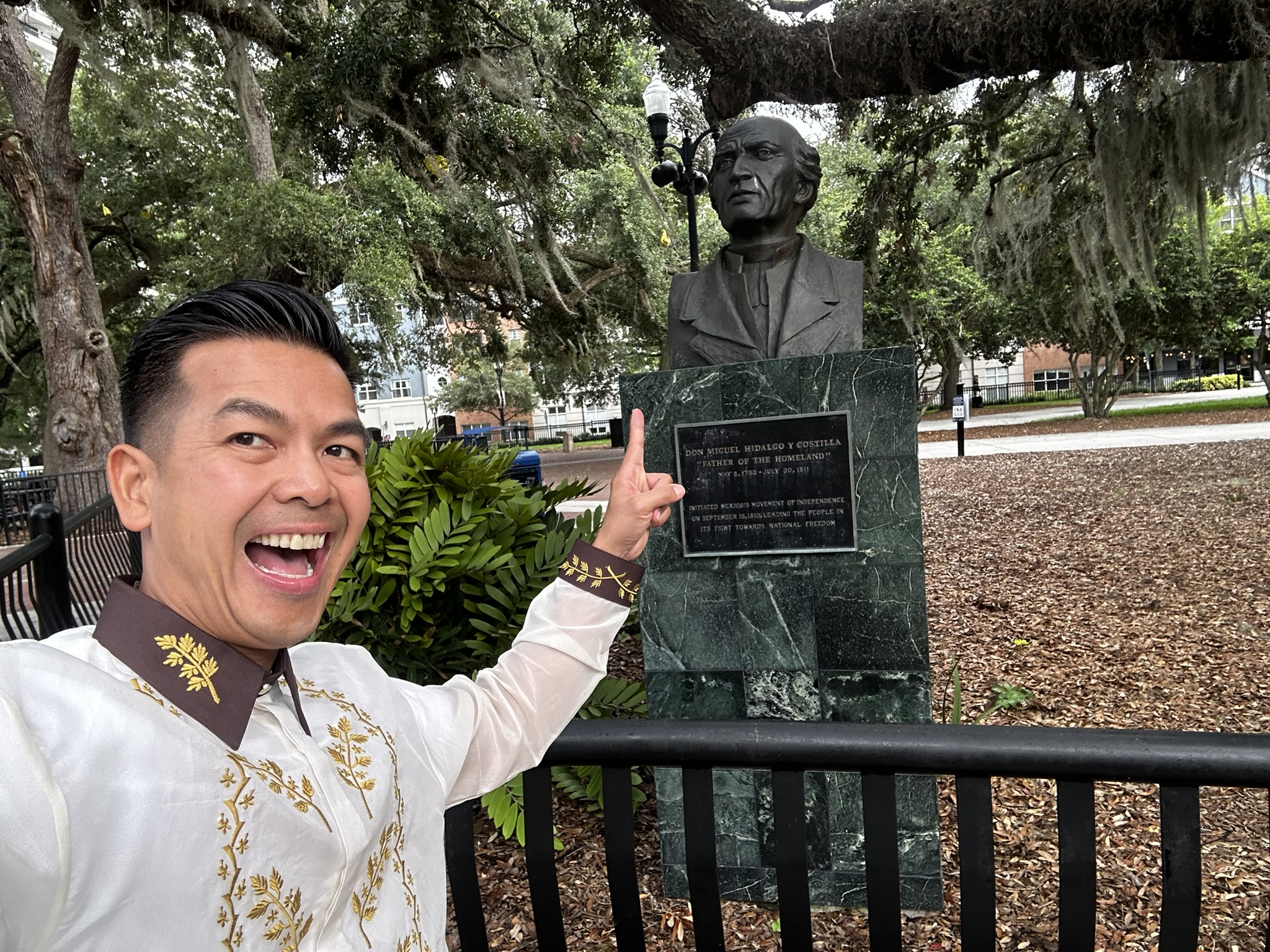 Knight in Barong Tagalog at monument in Florida park